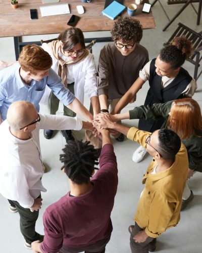 Photo Of People Holding Each Other's Hands